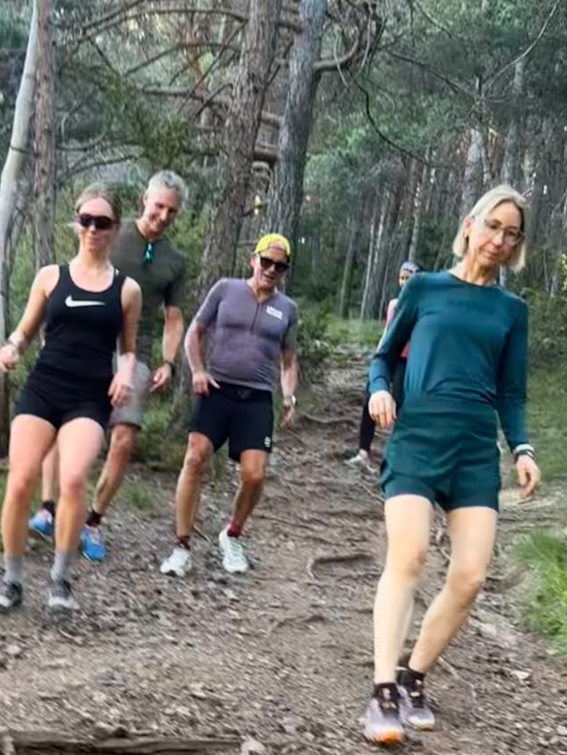 Group running together through the forest